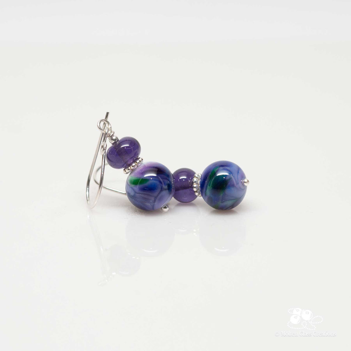 earrings with a purple marble style look