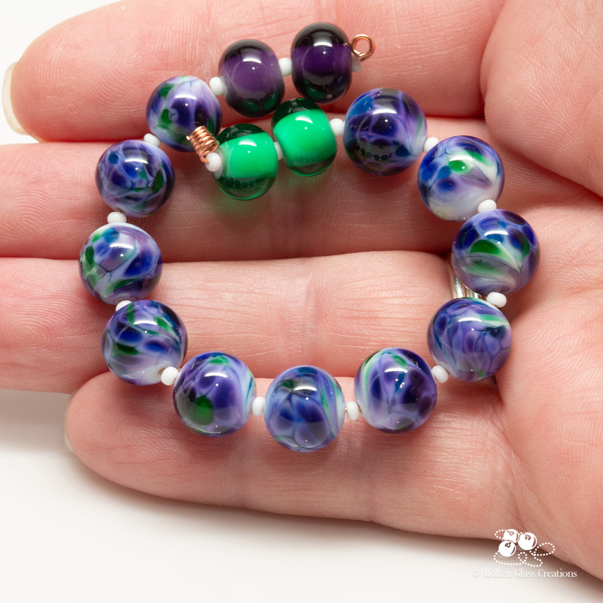 glass bead set consisting of purple, green and white
