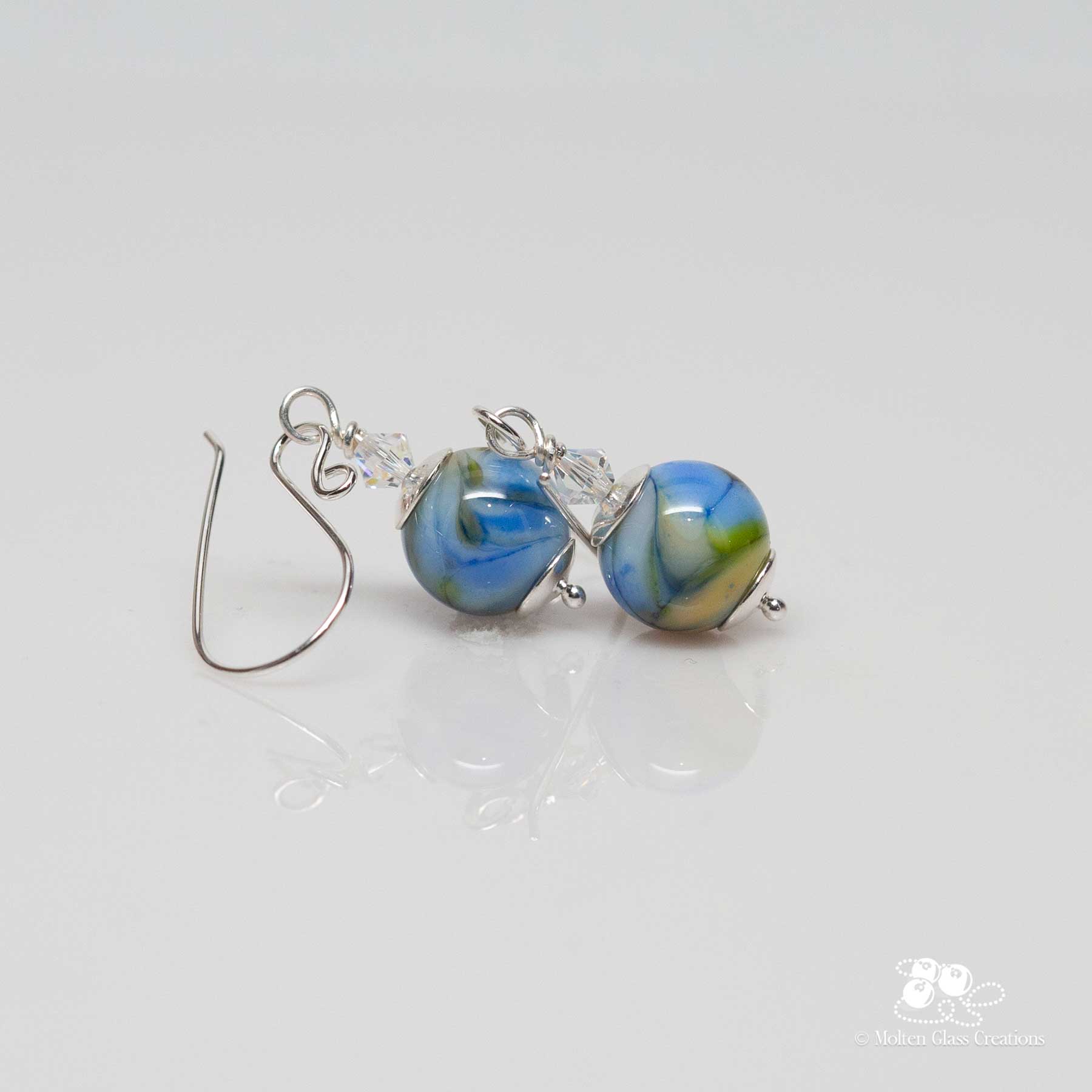 Earrings with a mix of blue, amber, and white colours