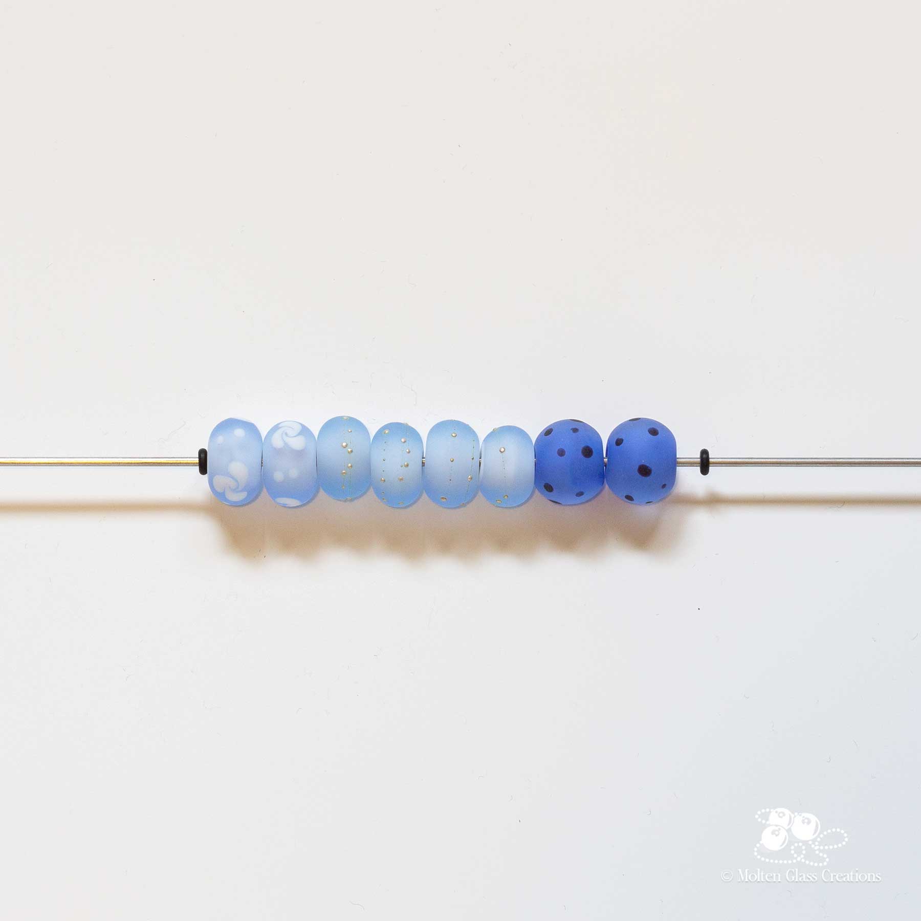a variety of blue glass beads